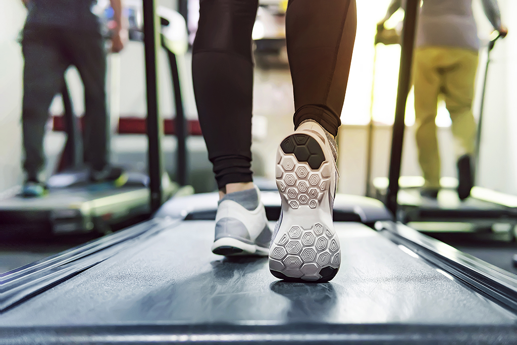 Exercise treadmill cardio running workout at fitness gym of woman taking weight loss with machine aerobic for slim and firm healthy in the morning. concept of running and sports. running athletes.