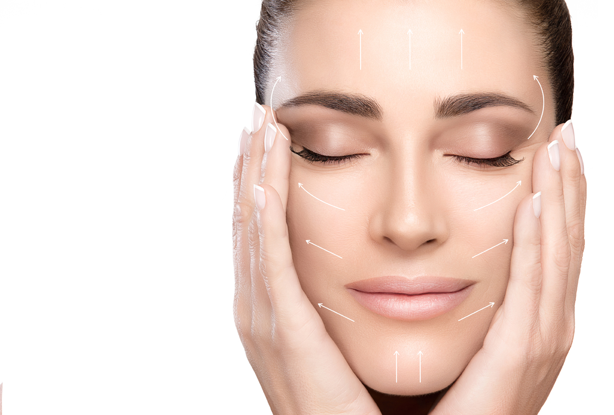 Anti aging treatment and plastic surgery concept. Beautiful young woman with hands on cheeks and eyes closed with a serene expression and white arrows over face. Perfect skin. Portrait isolated on white with copy space for text.